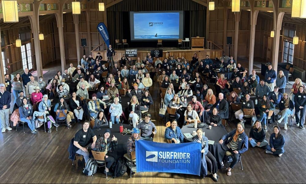 group of volunteers holding Surfrider banner at California Chapter Conference