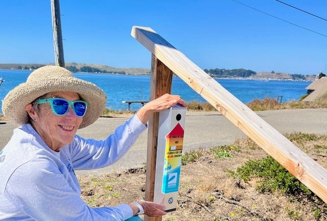 Sonoma Coast volunteer emptying butt can