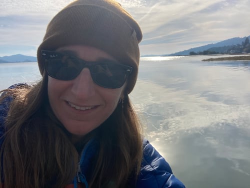 Woman with still water and reflection in the background