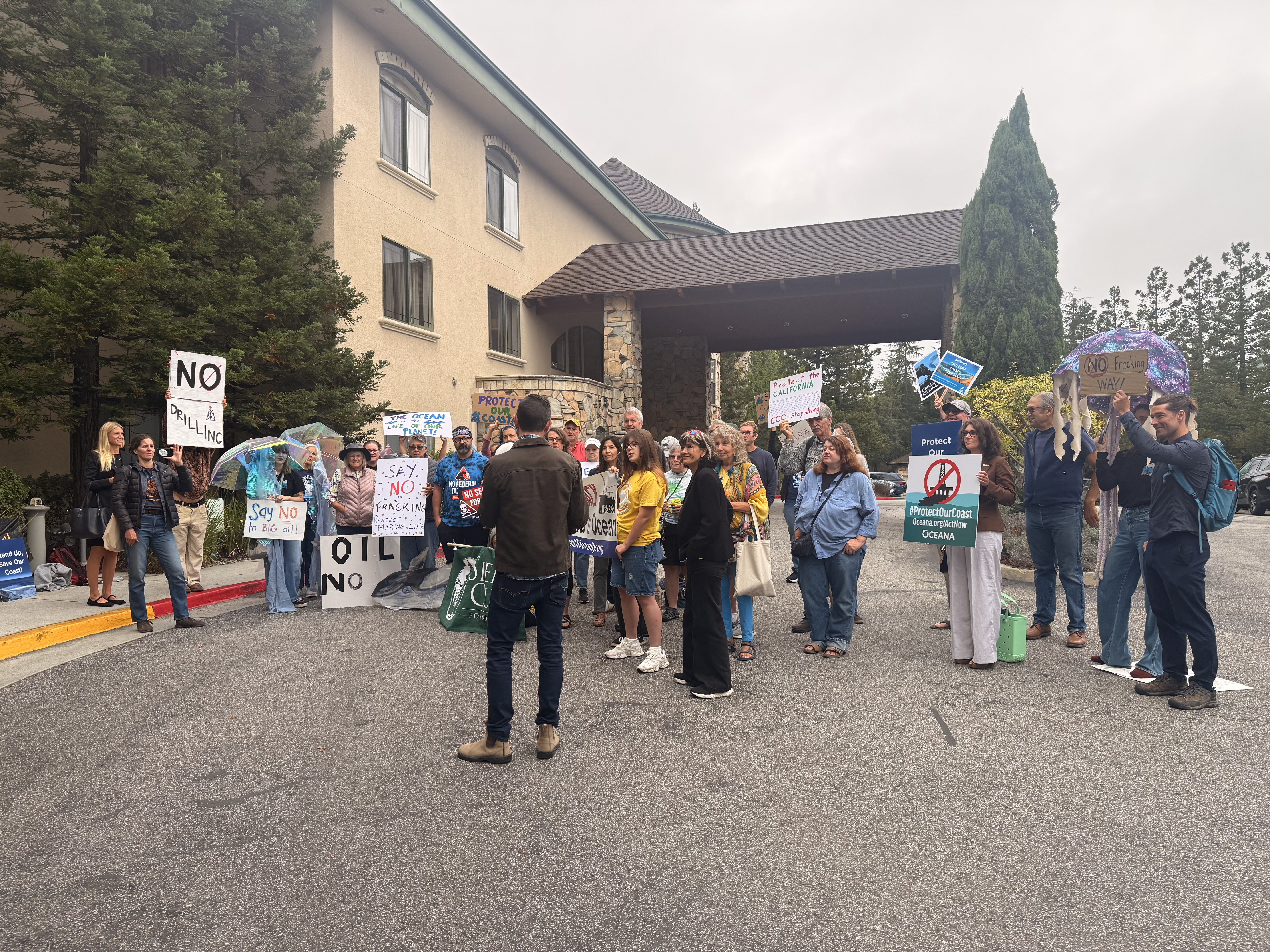  Matt Koller from Surfrider speaks at the pre-hearing rally to oppose offshore fracking